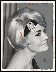 French dancer Noelle Adam displays the ultimate in head ornaments during an appearance in Munich, West Germany. She is wearing the $500,000, "Nepal" diamond that has been sold to a New York firm.