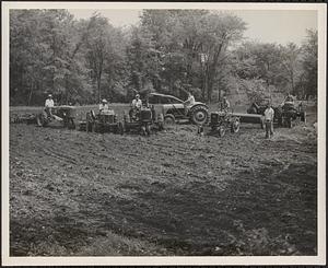 Members of the Whately Grange working together to plow a field on the Wallace Graves property in West Whately