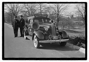 Policemen standing next to Boston Police Safety Education vehicle, Back Bay Fens