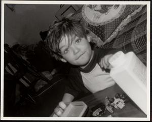 Little boy playing with toy cars