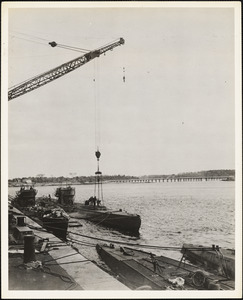 Unloading concealed material from German submarine