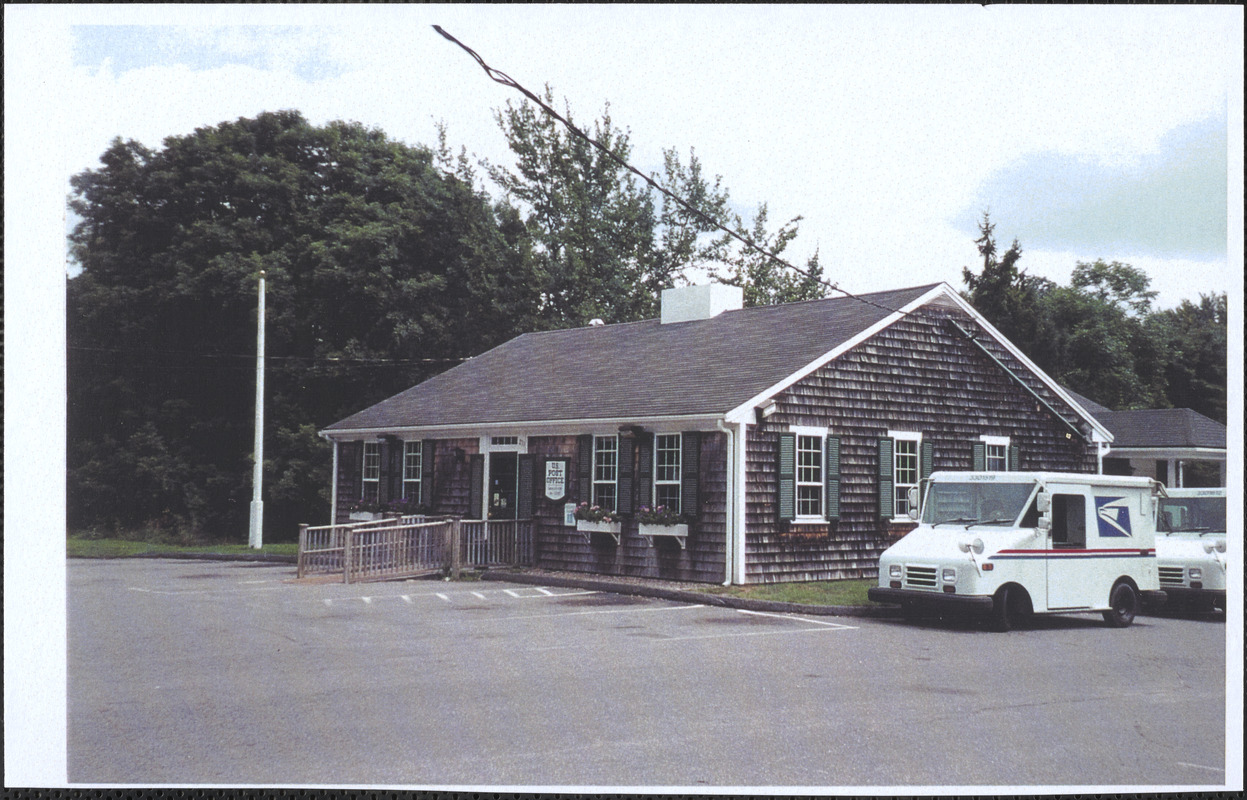 Yarmouth Port Post Office with mail trucks parked beside the building