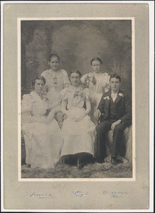 Five young people wearing corsages