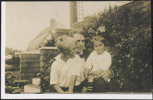 Gardner and Doris Schirmer sitting on the lap of Frank Schirmer, their grandfather