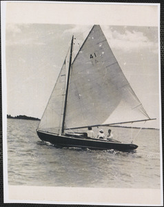 Three unidentified people on Beetle Cat boat on Lewis Bay