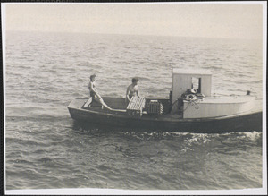 Two unidentified people on lobster boat