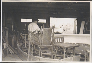 Man and furniture in garage after 1944 Hurricane in West Yarmouth, Mass.