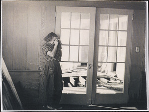 Doris Schirmer taking photographs during 1944 hurricane cleanup