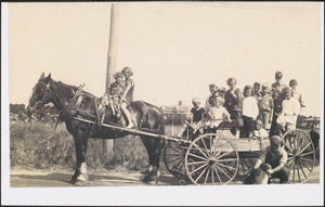 Doris Schirmer on horseback with Mr. Tripp and group of children