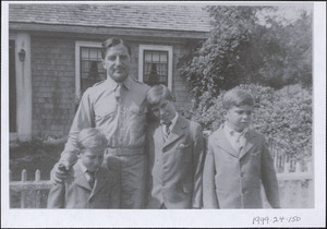 Guido Perera in uniform with his three sons