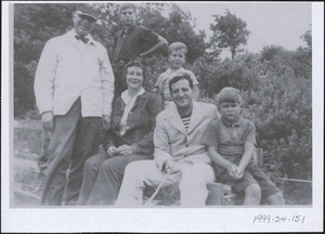 Guido Perera with Faith Perera, their three sons, and an unidentified man at left