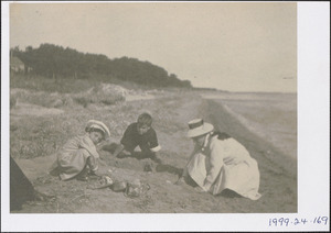 Guido Perera on the left with unidentified woman and boy at the beach