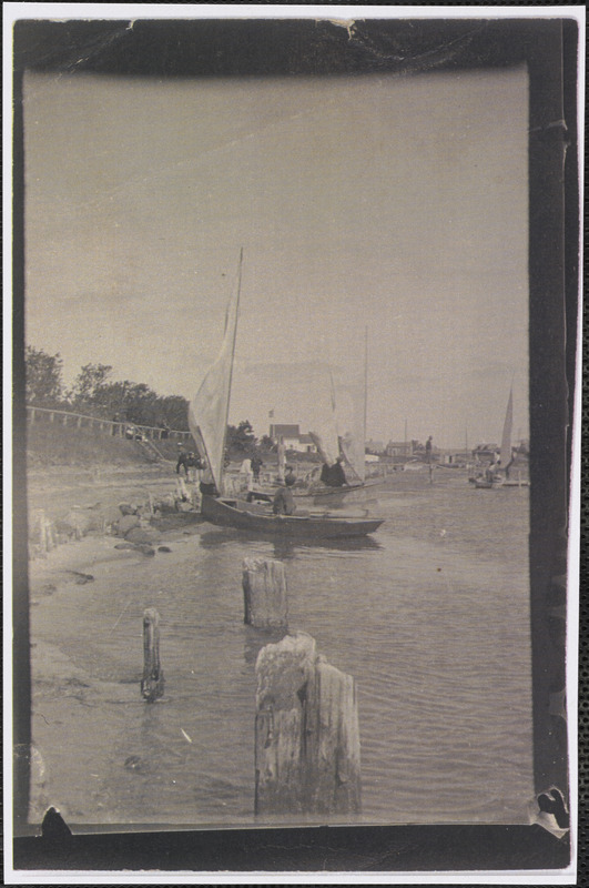 Boat Elf owned by William B. Lawrence tied to his dock on Bass River