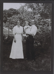 Unidentified man, woman, and child