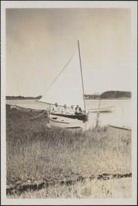 Marjorie, Harriet, Laura, and unidentified man in cat boat