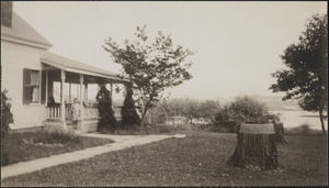 Child on porch at 6 Bellevue Avenue, South Yarmouth, Mass., looking toward Bass River