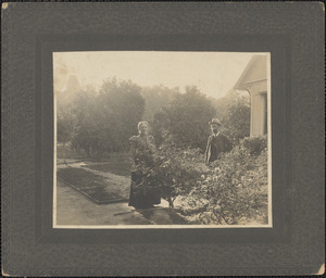 Unidentified man and woman in a garden