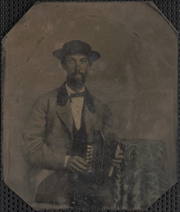 Tintype of man holding concertina
