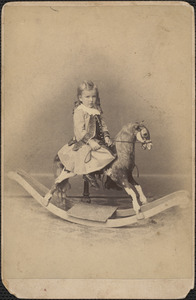 Young girl on hobby horse
