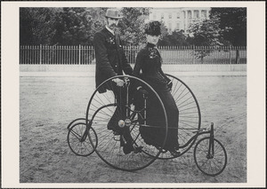 Young married couple on a bicycle posing in front of the White House