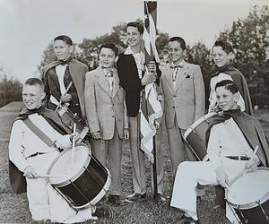 Four drummers and a flag bearer