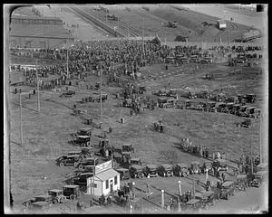 Cars and a crowd in an unidentified location