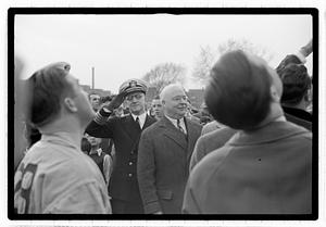 Boston Park Department Commissioner William Long in front of a officer saluting