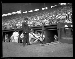 Umpire Bill McGowan outside dugout at Fenway Park, Boston