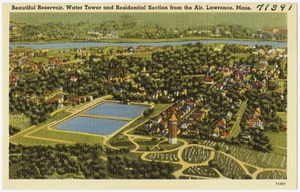 Beautiful reservoir, water tower and residential section form the air, Lawrence, Mass.