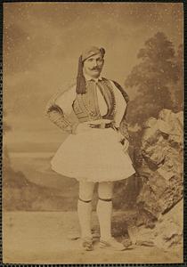 Studio portrait of man in traditional Greek dress