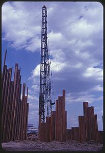 Construction crane and retaining wall