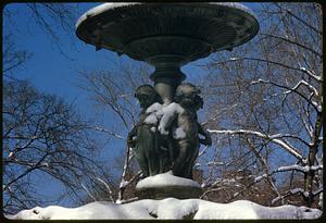 Snow on figures of children around upper part of Brewer Fountain, Boston