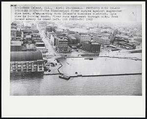 Seawall Protects Rock Island Business District-The Mississippi River surges against augmented dike here, safeguarding Rock Island's business district. This view is looking south. River runs east-east through city. Rock Island armory is lower left.
