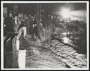 Taunton dam, Morey Dam scene as water rises, grim faces express wait + see