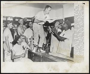 Take Over First Berth--Some players of the Chicago White Sox go through high jinks before today's game after they took over first place in the American League by beating the Boston Red Sox, 10 to 7 last night. Left to right, are: catcher Les Moss, shortstop Chico Carrasquel, strumming a bat; first baseman Walt Dropo, rear; pitcher Harry Byrd; second baseman Nellie Fox, on trunk; outfielder Jim Rivera, and outfielder Minnie Minoso. Byrd will attempt to hold Boston again today and maintain first place.