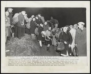Jewish Immigrants Await Embarkation From Italian Beach – After being driven from refugee camps in buses, Jewish immigrants stand on beach near Rome, Italy, on night of Dec. 11, awaiting turns to be taken to two-masted schooner “Al Tafchidunu” in rubber rafts. The immigrants were captured yesterday by British destroyers when their vessel tried to run the blockade near Haifa, Palestine.