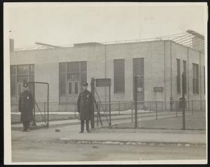 Immigration Office Guard. Special delta of officers on duty at the immigration station. East Boston, pending disposition of cases of Devine, Murdock and Berkman Lawrence strike leaders. Left to right, Patrolmen Cohen and Fitzgerald.