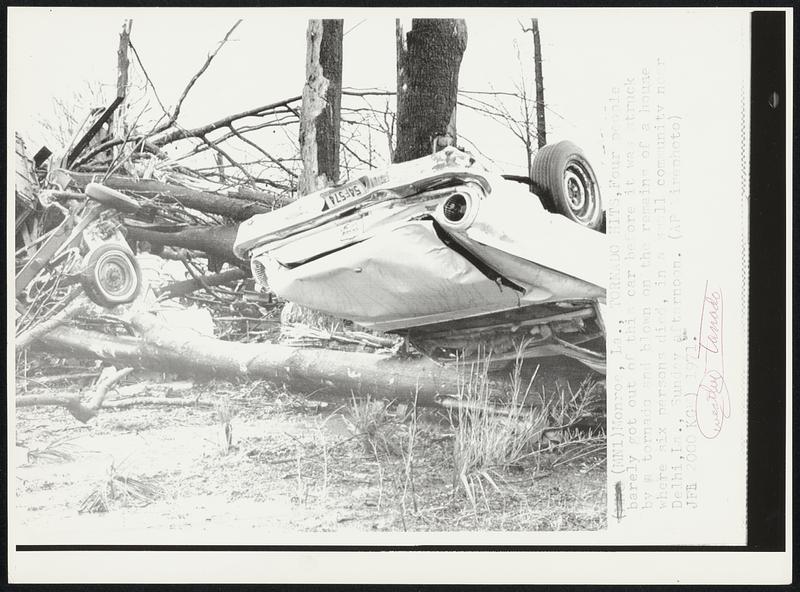 Tornado Hits, Four people barely got out of this car before it was struck by a tornado and blown on the remains of a house where six persons died, in a small community near Delhi, La., Sunday afternoon.