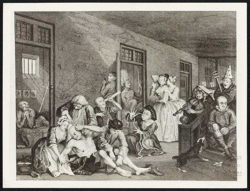 An interior of an 18th century madhouse as shown by the famous English engraver, Hogarth, in his series of etchings called "The Rake's Progress."