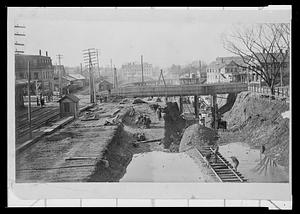 Digging to depress the railroad tracks, looking west showing Main St. and Walnut St. bridges