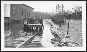 Pepperell Paper Mill flood damage with trestle and flooded railroad tracks