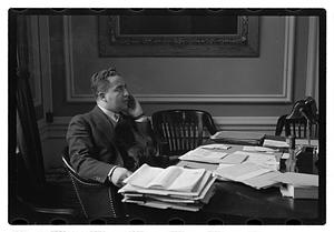 A man seated at a desk