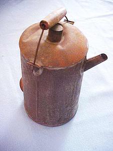Metal can with a wooden handle
