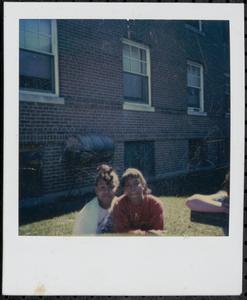 Two friends sitting in the sun