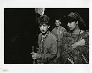 Three students in theater costumes