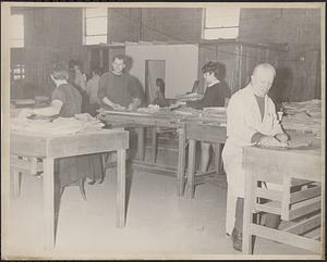 People cleaning papers at Clark-Aiken