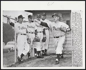 Freshmen Watch Sophomore at Work - Righthander Jack Sanford of the Philadelphia Phillies, 1957 National League Rookie Of The Year, fires pitch during warmup at spring training camp today. Watching are four rookie pitchers on the squad. From left: Roman Semproch, Cleveland, O.; Tom Qualters, McKeesport, Pa.; Bob Conley, Warwick, Va., and John Gray, West Palm Beach, Fla. All played for Miami, Fla. (International League) last year, except Gray, who pitched for San Diego, Calif. (Pacific Coast League). Ball appears as fuzz above cap of Qualters.