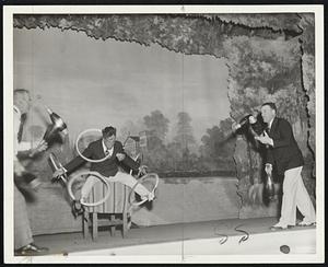 Hart Dunn & Dynes jugglers shows as they reached the climax of their act. This is also from the Federal Theatre vaudeville project. Action shot.
