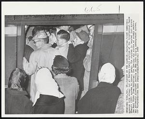 Caught in the Squeeze -- Manhattan-bound commuters squeeze into subway car at Hunters Point station of the Interborough Rapid Transit (IRT) system in Queens today. The station is located just across the East River from Manhattan. The two-day old strike of subway workers has seriously disrupted service on New York City's underground system.