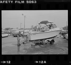 Two people washing boat